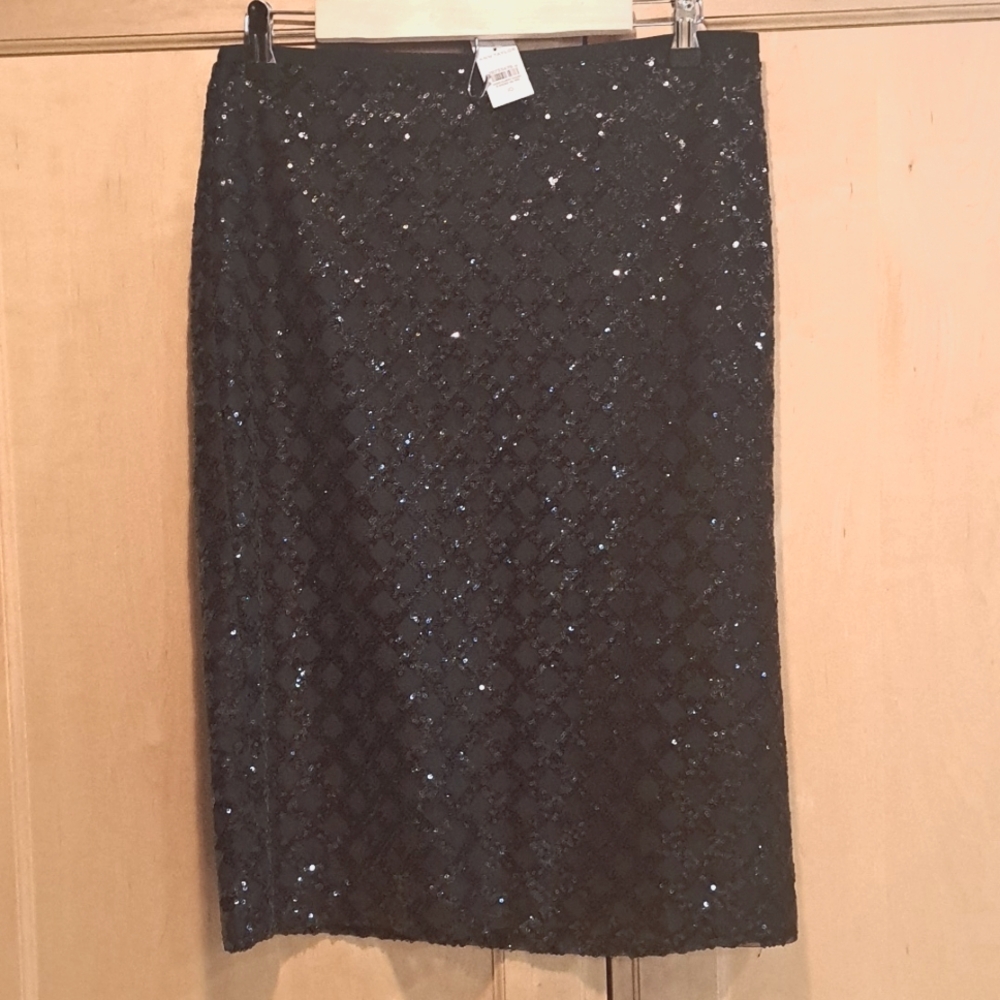 Brand new Ann Taylor black sequins midi skirt, slit on 1 side. Elegant!